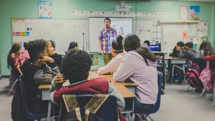 a teacher and students in a classroom